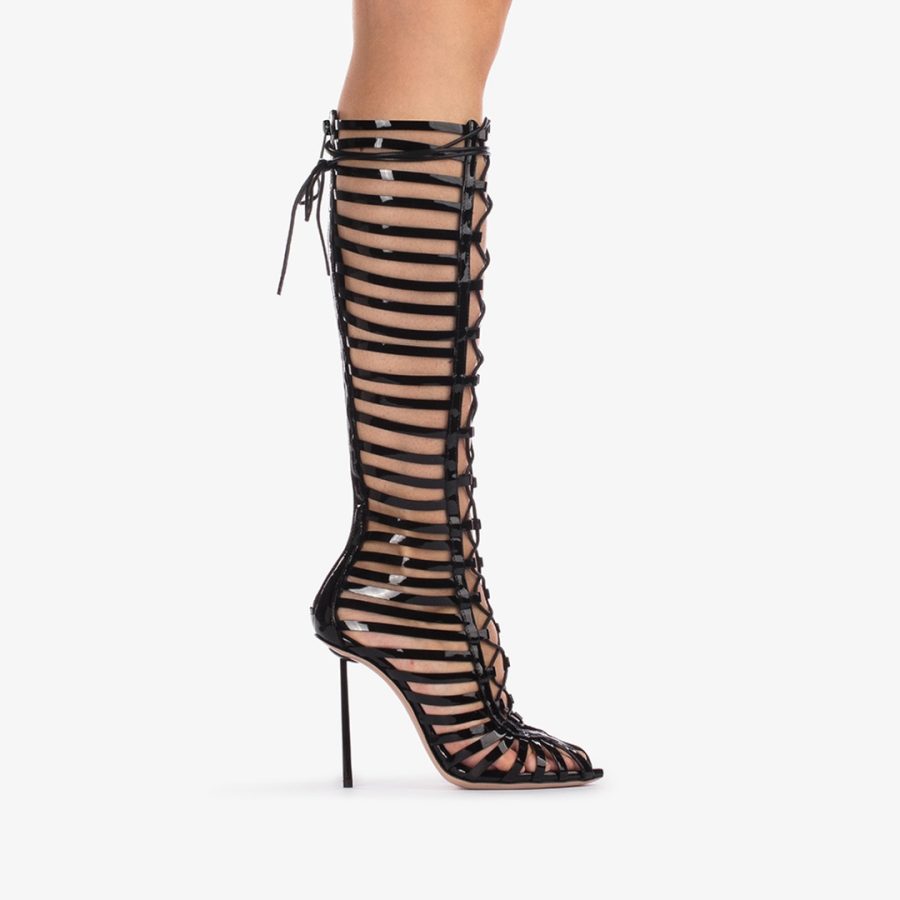 CAGE BOOT 120 mm-Black patent leather gladiator knee boot with straps